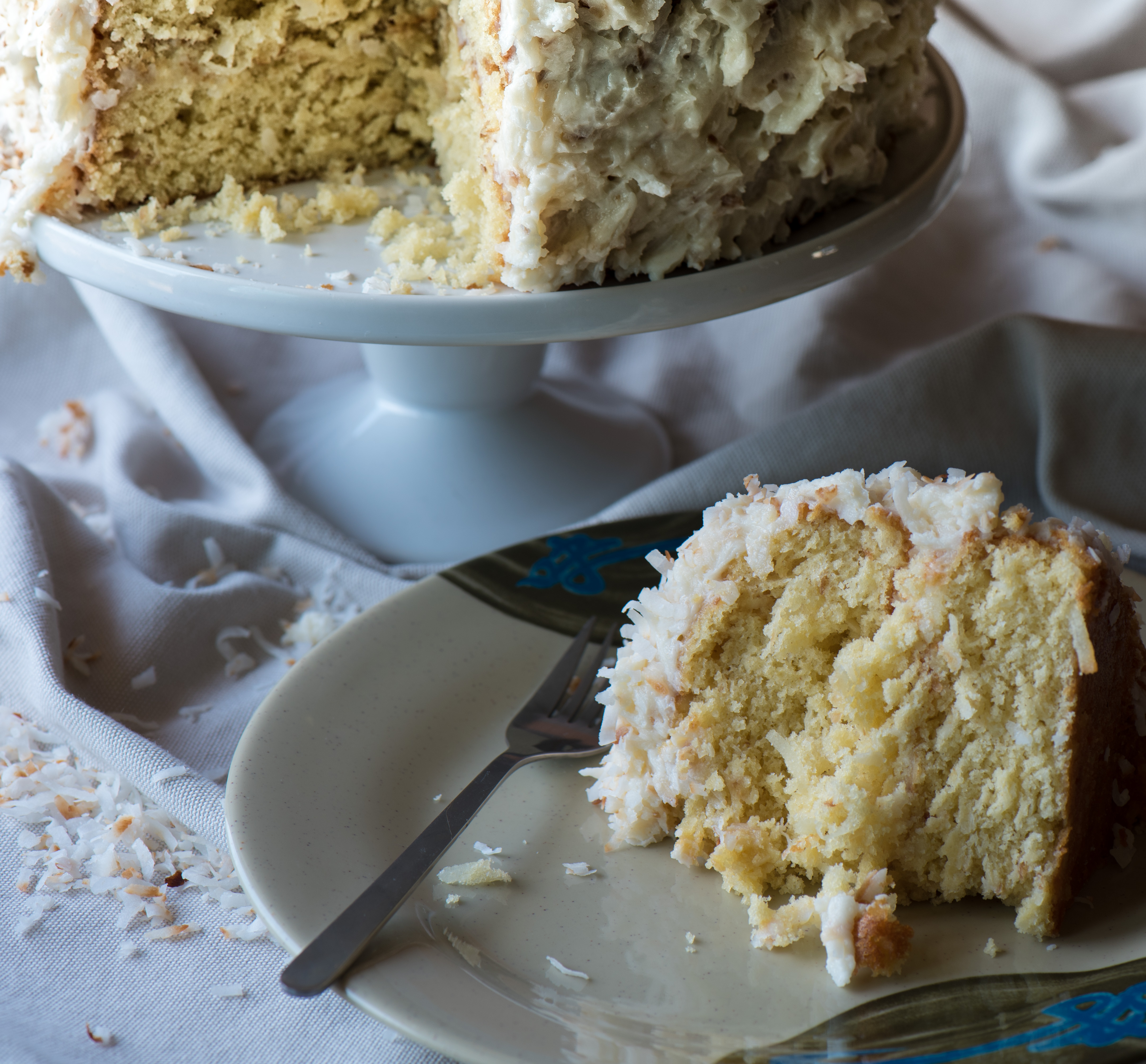 The essential coconut cake recipe for your arsenal! And the cream cheese frosting . . . oh yeah! | The Recipe Wench