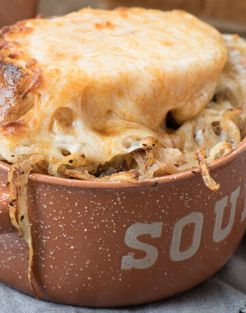 A quick and simple French Onion soup recipe. Top with hearty French bread and melty cheese for a delicious meal! | The Recipe Wench