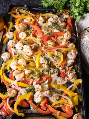Shrimp fajitas are a brilliant and easy meal that can be cooked in the oven and served family style! | The Recipe Wench