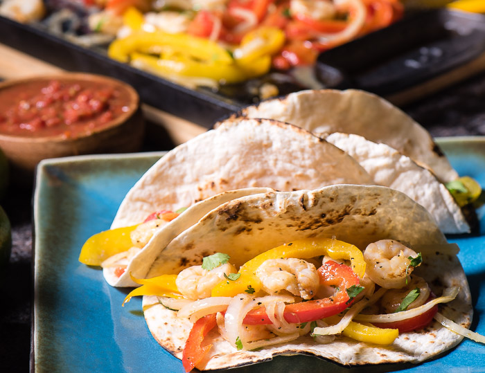 Shrimp fajitas tacos is a brilliant meal -- as perfect for hectic weekday meals as they are for leisurely weekend meals.