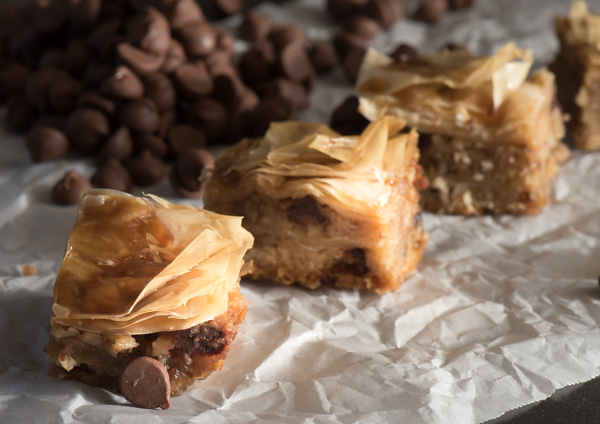 Chocolate Chip Baklava with layers of delicate, flaky (store bought!) phyllo dough. Drizzled with a brown sugar vanilla glaze | The Recipe Wench