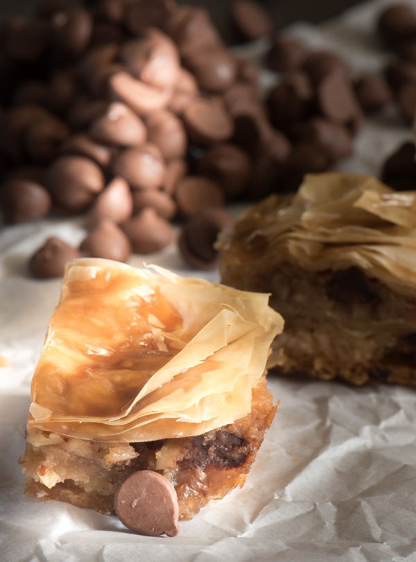 Chocolate Chip Baklava -- delicate, flaky phyllo dough layers over an eggless chocolate chip cookie dough. A great twist on tradition! | The Recipe Wench